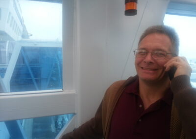 Douglas with Cellphone on Cruise